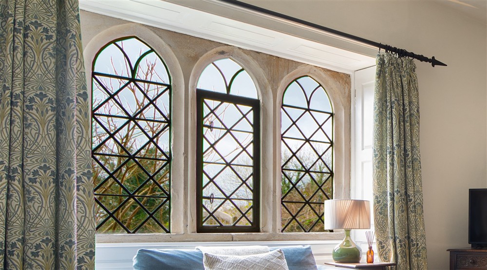 The latticed arched windows at Newark Lower Lodge in Wotton-under-edge, Gloucestershire