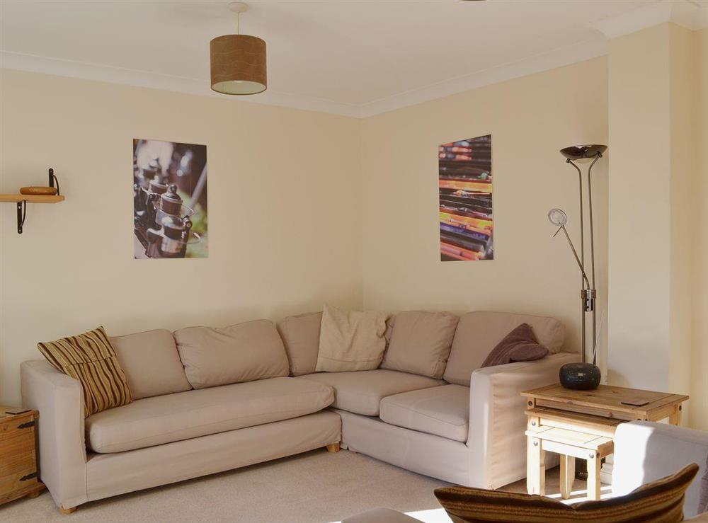 Bright, spacious living room with comfortable sofas and an contemporary decor at Anglers Rest, 
