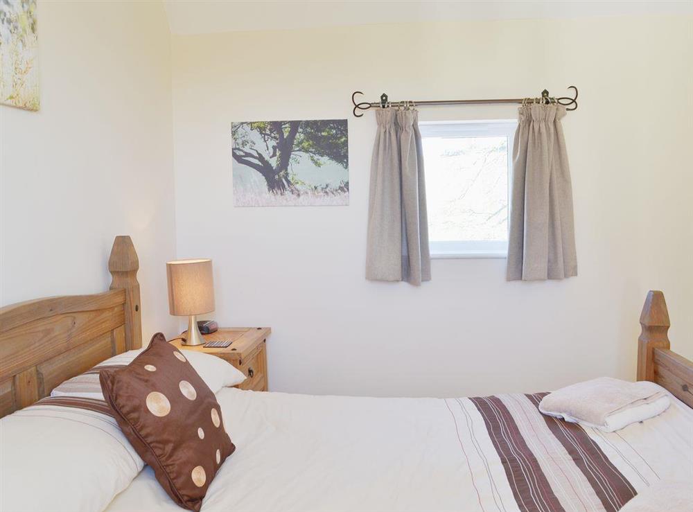 Crisp white linen makes the bedroom welcoming and relaxing at Anglers Rest, 