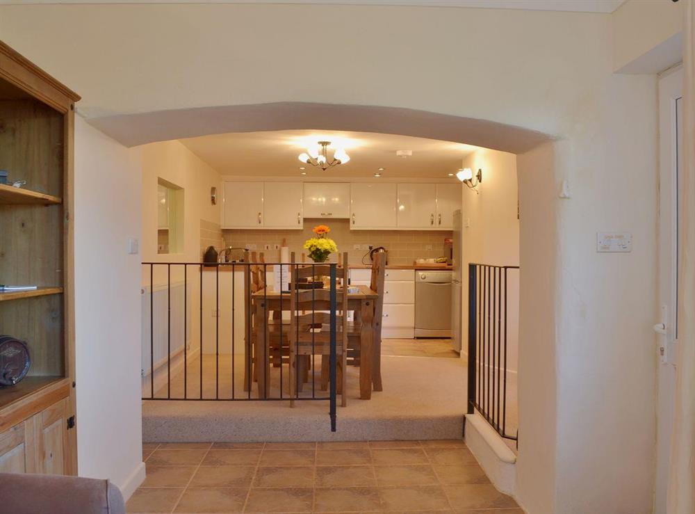 A grand arch sparates the living area from the kitchen/dining areas at Badgers Holt, 