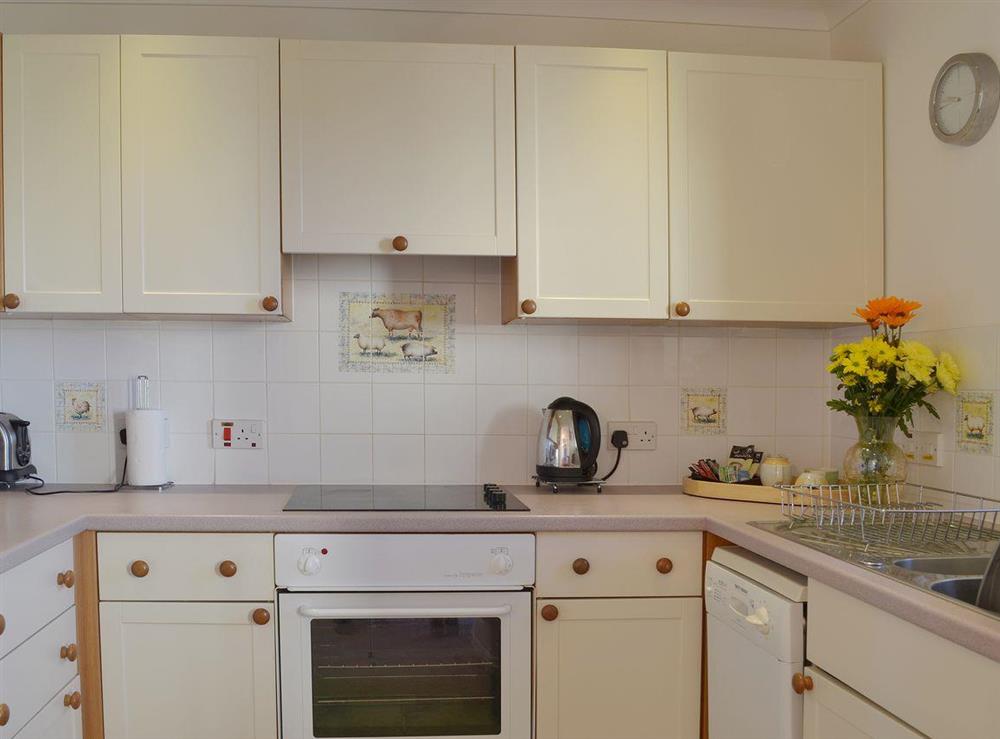 Contemporary appliances combine well with the cottage-style kitchen at Oak Tree Cottage, 
