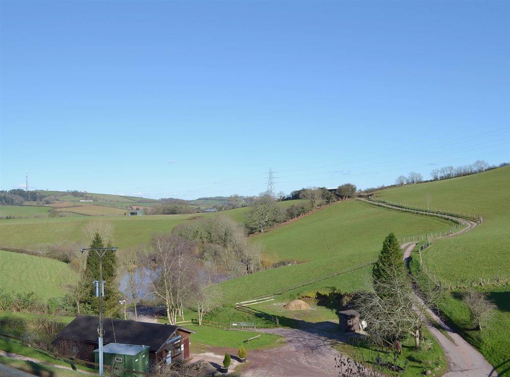 Fine views across the fishing ponds and the valley below at Oak Tree Cottage, 
