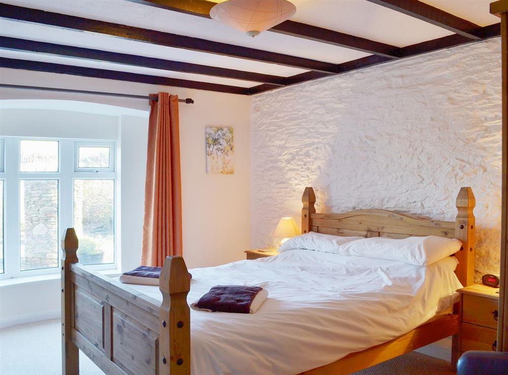 The romantic, cosy beamed bedroom at Pheasants Hide, 