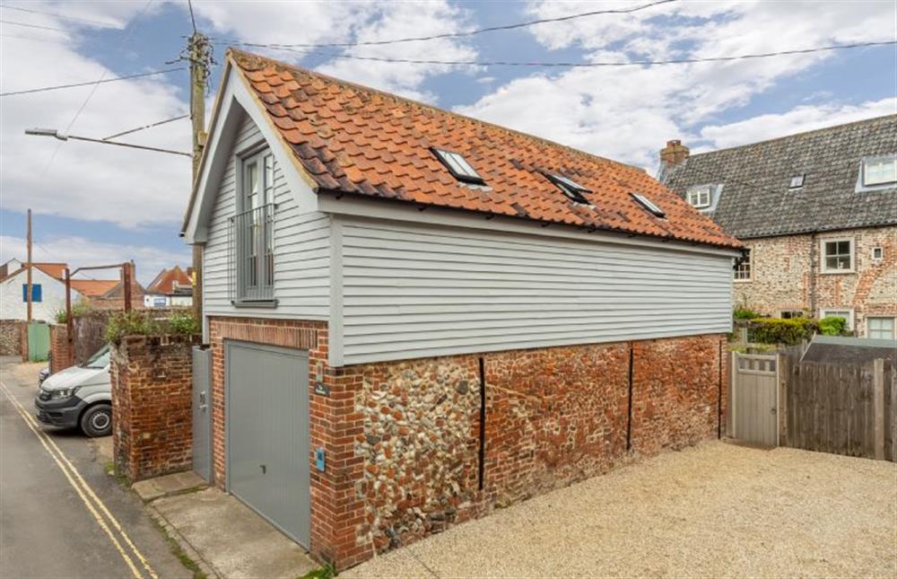 Because the road is narrow the garage can only accommodate one medium-size car at Newgate Boathouse, Wells-next-the-Sea