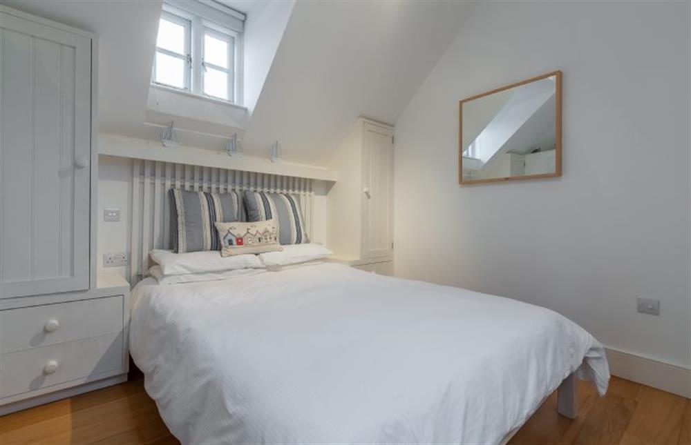 Contemporary bedroom area with double bed at Newgate Boathouse, Wells-next-the-Sea