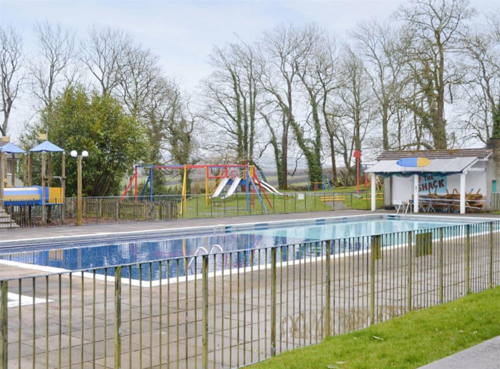On-site swimming pool and children’s play area at Newquay Holiday Villa in Newquay, Cornwall