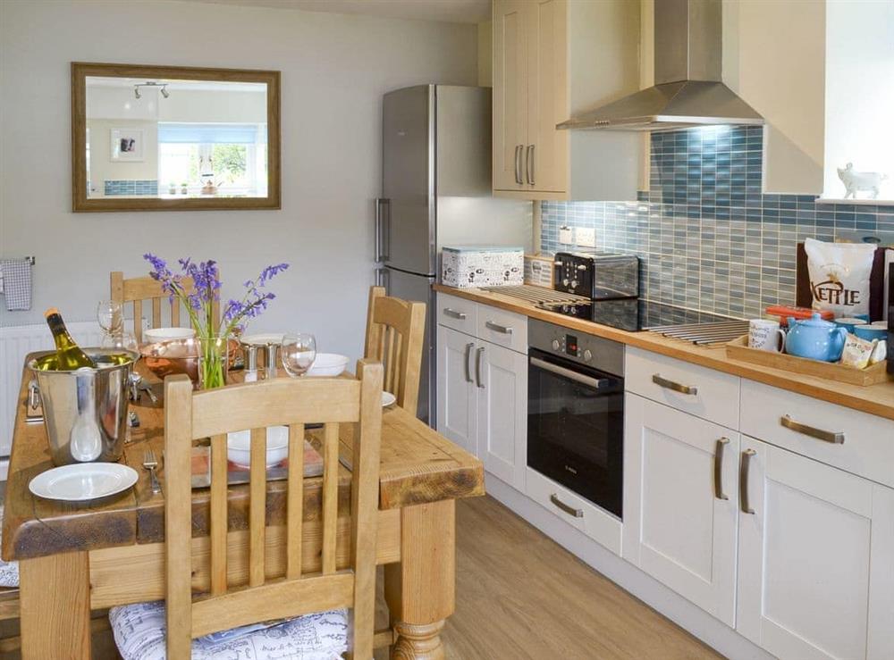 Fully appointed kitchen with dining area at Newstead Cottage in Thornton-le-Dale, near Pickering, North Yorkshire