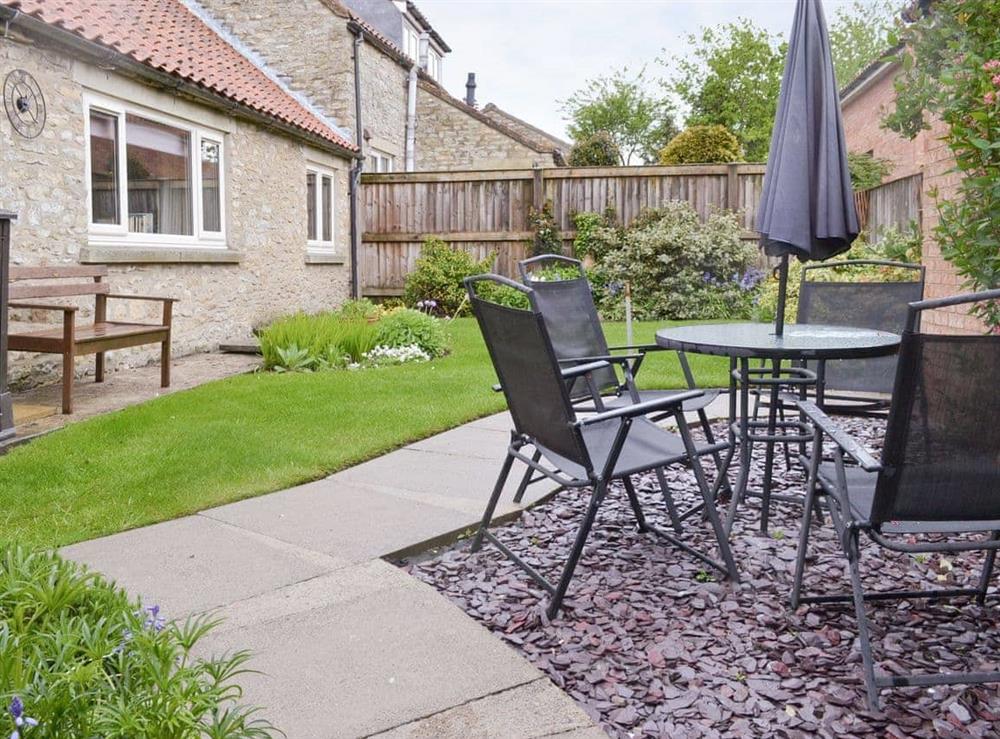 Patio area with outdoor furniture at Newstead Cottage in Thornton-le-Dale, near Pickering, North Yorkshire