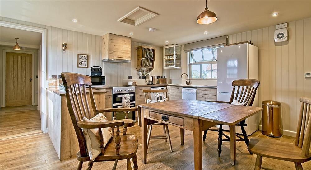 The kitchen and dining room at Newtown Cabin in Newtown, Isle Of Wight
