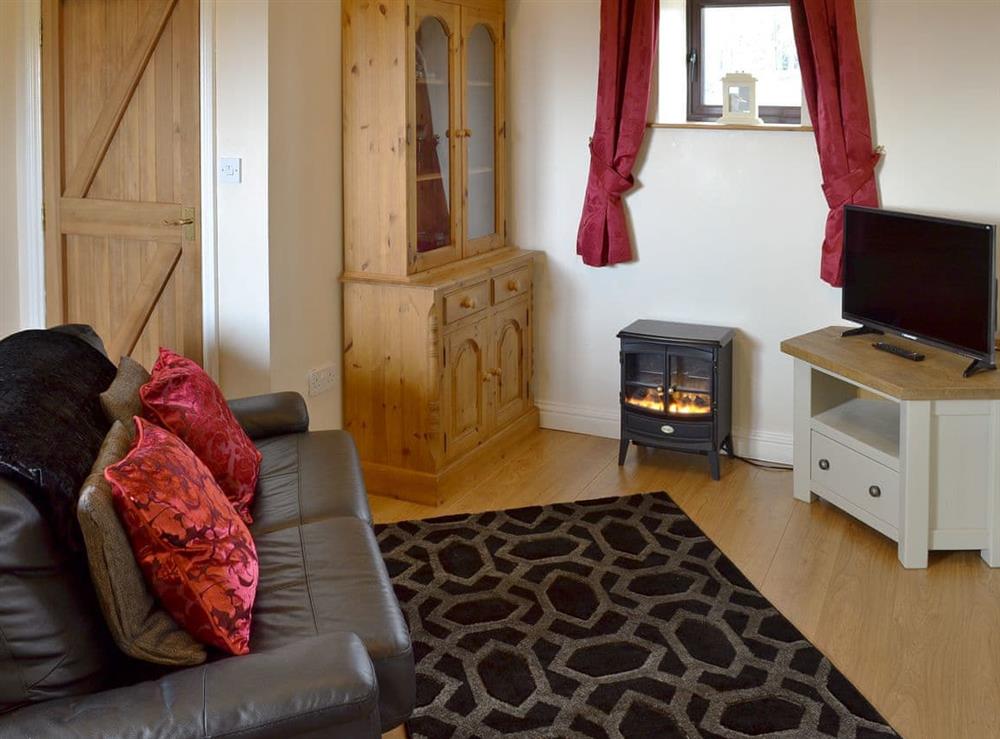 Cosy living/ dining room at Nield Bank Bungalow in Quarnford, near Buxton, Staffordshire