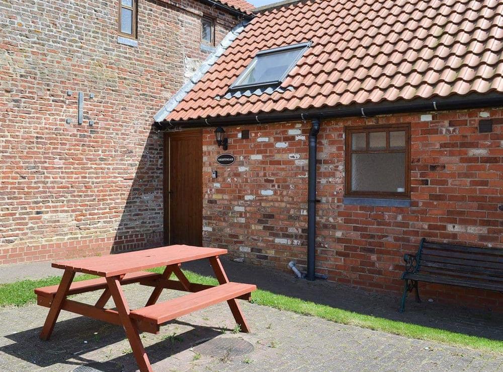 Courtyard entrance with picnic style seating at Nightingale in Flamborough, North Humberside