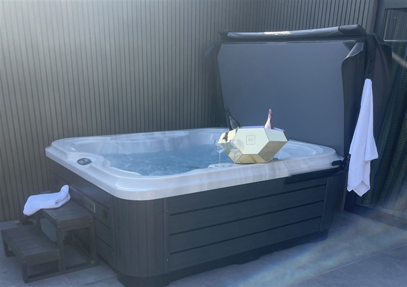 Relax in the hot tub at Ninky Nonk, Bishop Sutton
