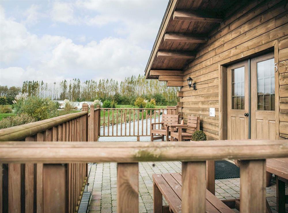 Decked area with outdoor furniture at No. 1 Lake View Lodge in Old Leake, near Boston, Lincolnshire
