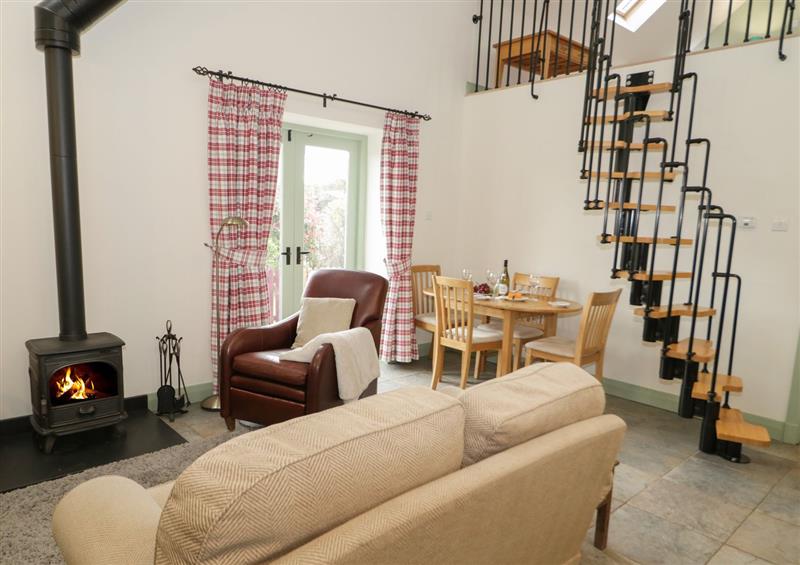 Enjoy the living room at No 1 The Granary, Capel Coch near Llannerch-Y-Medd
