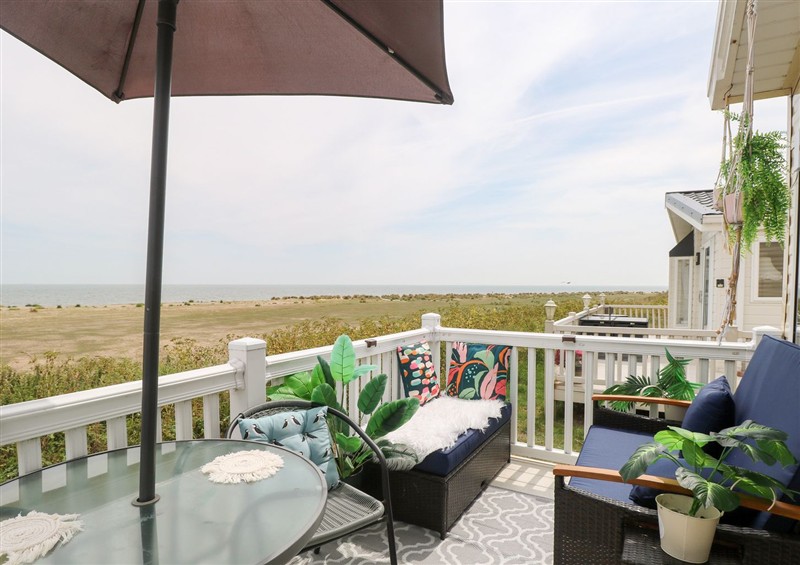 Enjoy a glass of wine on the patio at No. 2 - Seaview, Kessingland