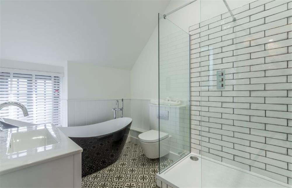 First floor: Bathroom has free-standing bath and separate shower at No. 33 Cottage 2, Thornham near Hunstanton