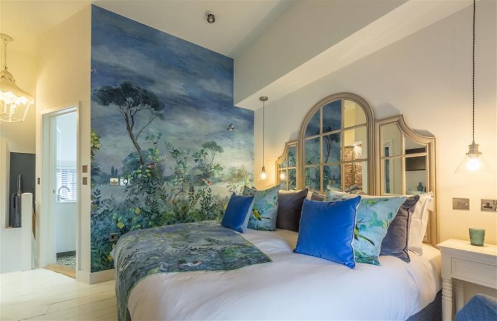 First floor: Mural wallpaper in this super luxurious bedroom at No. 33 Cottage 2, Thornham near Hunstanton