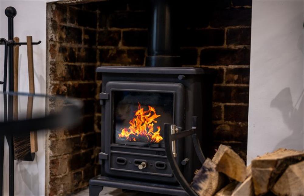 Ground floor: Cosy wood burning stove at No. 33 Cottage 2, Thornham near Hunstanton
