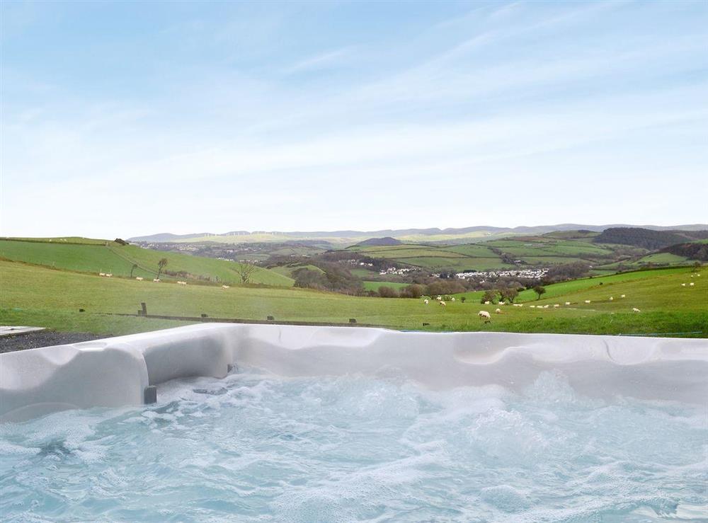 Relaxing hot tub with wonderful views of the Welsh country side at No 4 Pengraig Draw in Aberystwyth, Dyfed