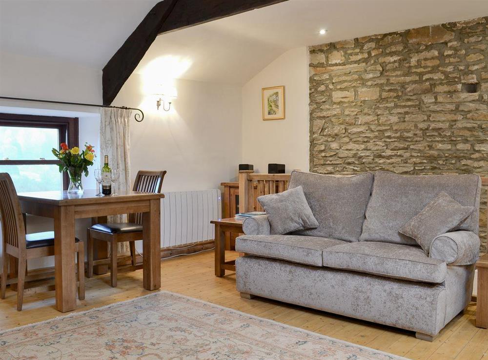 Comfortable and well furnished open plan living space at No 6 Swallowholm Cottages in Arkengarthdale, North Yorkshire