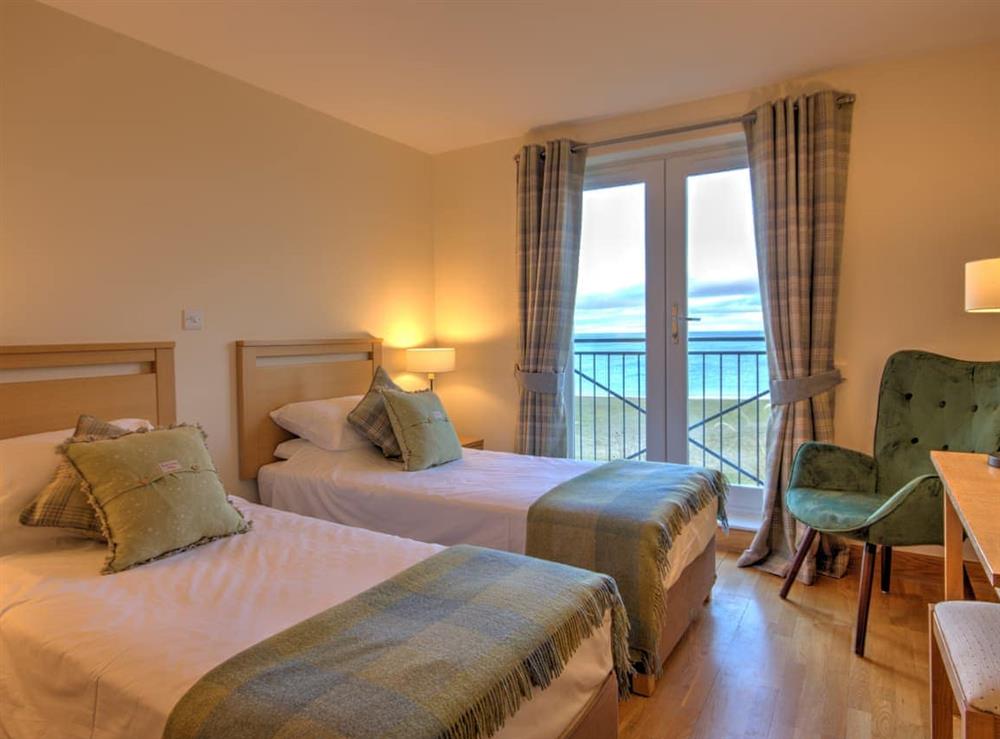 Twin bedroom at No.10 The Links Apartments in Brora, Sutherland