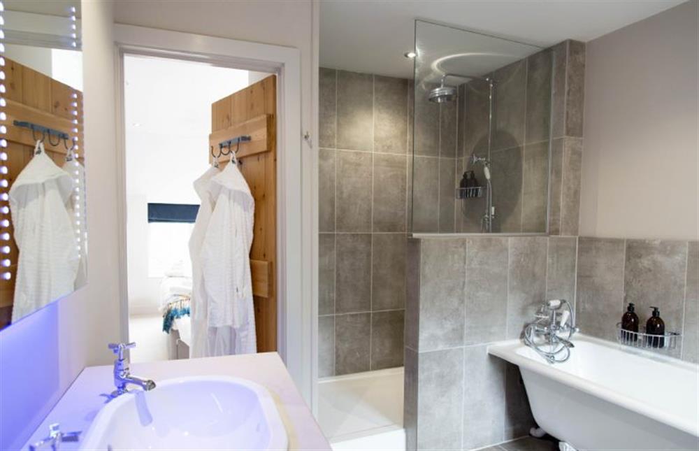 First floor: Bathroom with walk-in shower and roll-top bath at No.33 Cottage 1, Thornham near Hunstanton