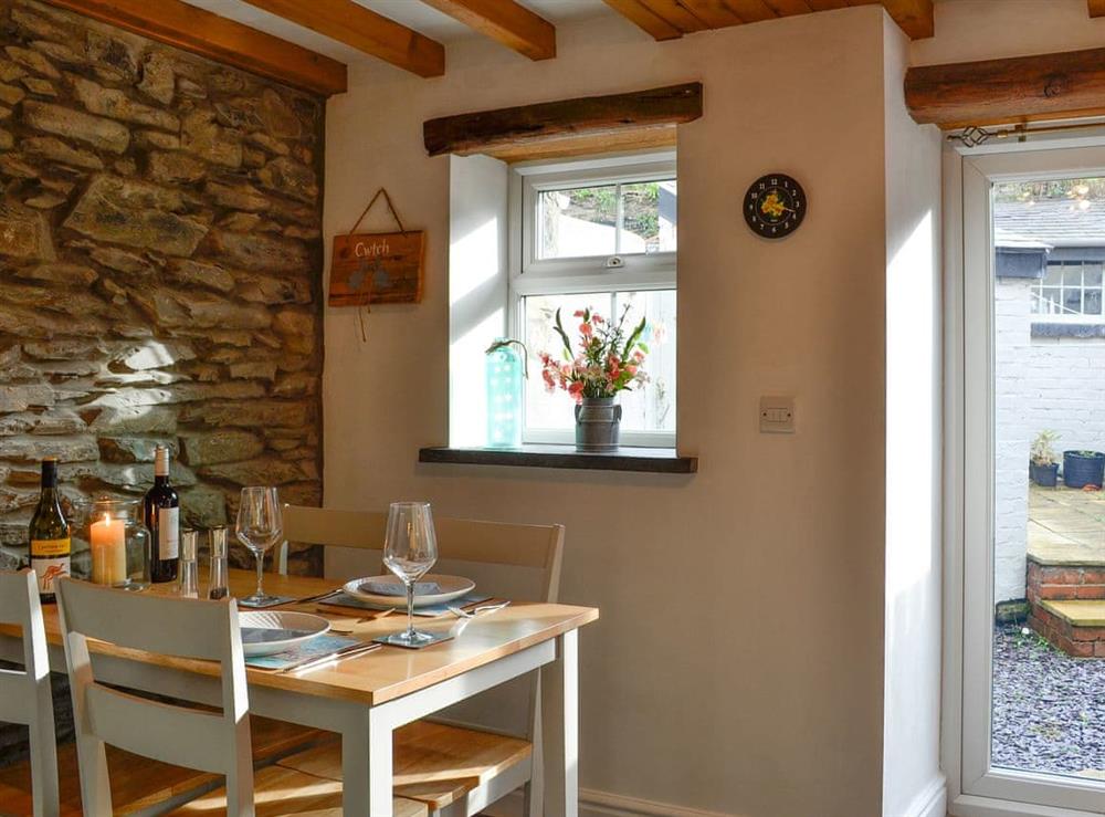 Beamed kitchen/dining room at Noddfa Cottage in Llanfairtalhaiarn, near Abergele, Clwyd
