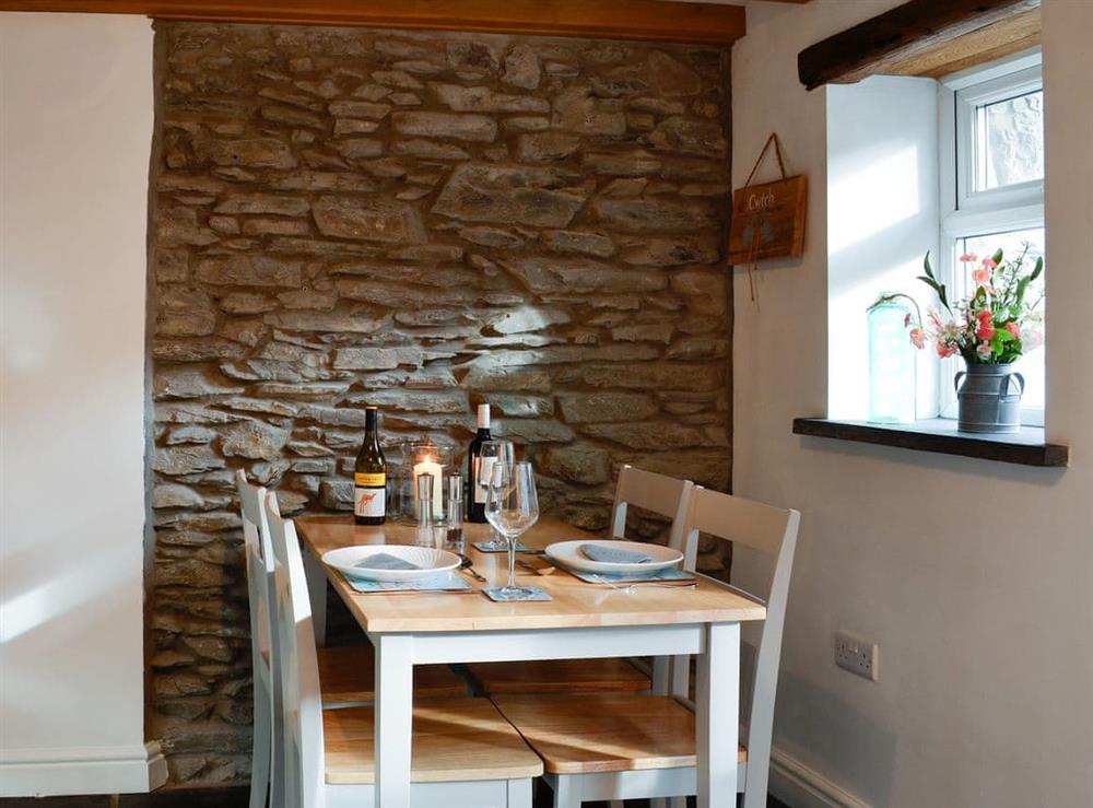 Modest dining area in the kitchen at Noddfa Cottage in Llanfairtalhaiarn, near Abergele, Clwyd