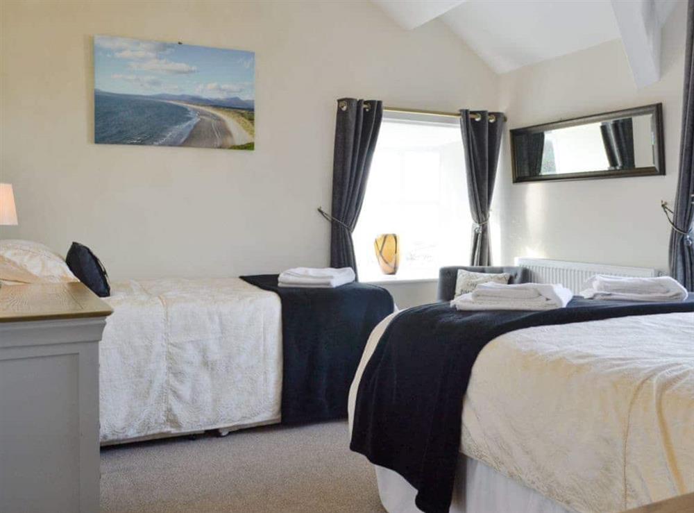 Family bedroom with a double and a single bed at Noddfa in Harlech, Gwynedd., Great Britain