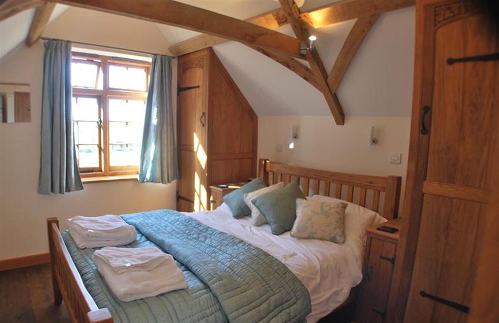 First floor:  Double bedroom with vaulted beamed ceiling at Nooky House, Cley-next-the-Sea near Holt