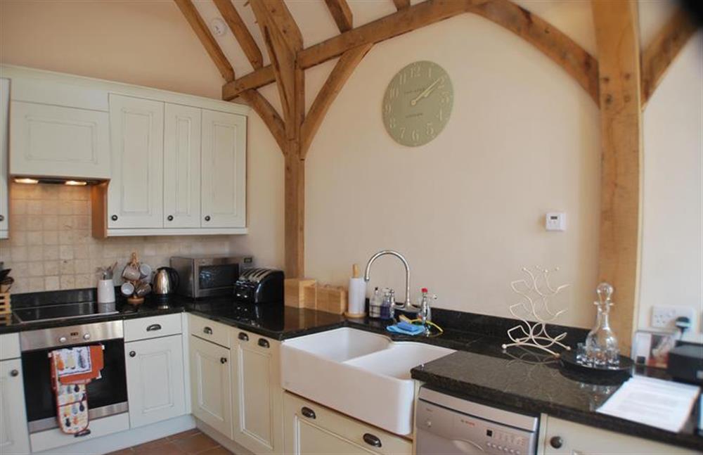 Ground floor:  Kitchen area with feature beams and double sink at Nooky House, Cley-next-the-Sea near Holt