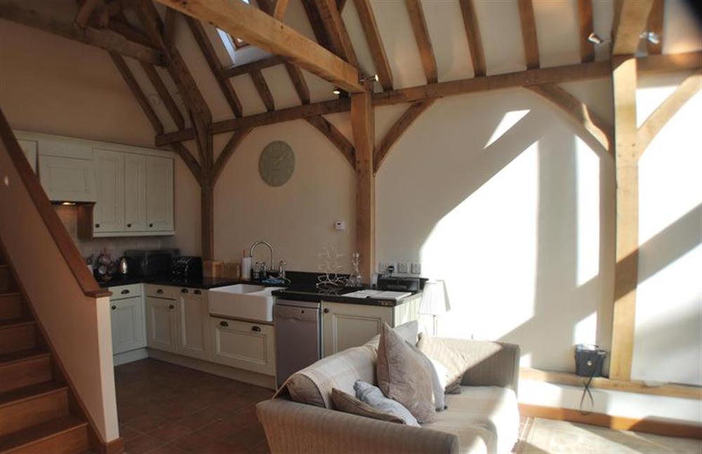Ground floor:  Kitchen area with stairs to first floor at Nooky House, Cley-next-the-Sea near Holt