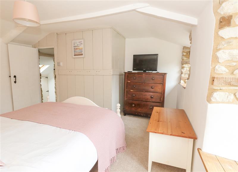 A bedroom in Norden Cottage (photo 2) at Norden Cottage, Osmington