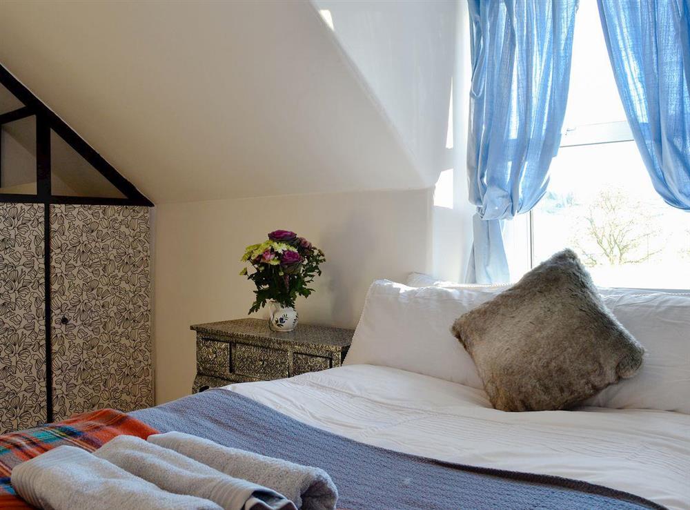 Cosy bedroom with single bed and ¾ double bed at North Balloch Farmhouse in Barr, near Girvan, Ayrshire