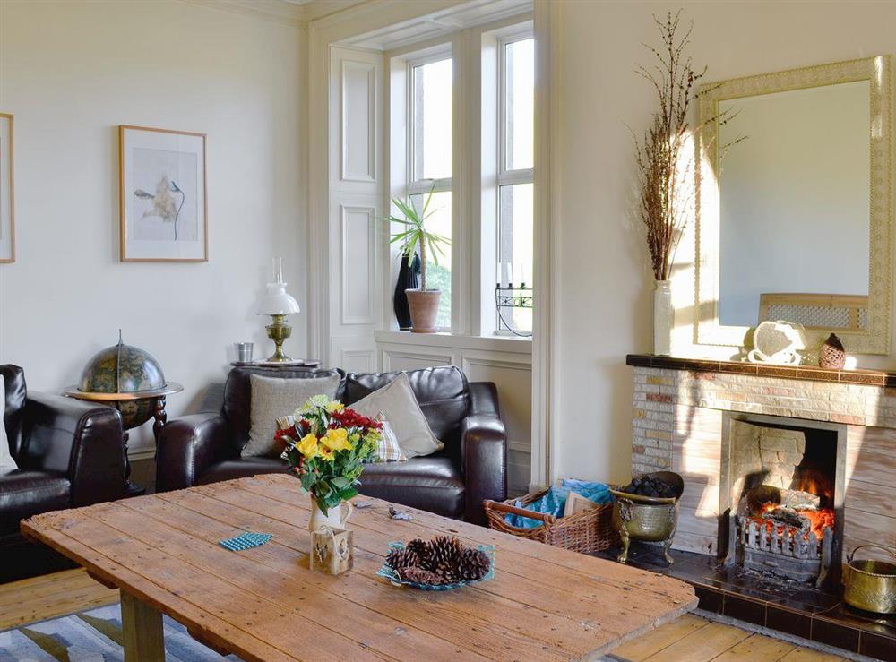 Large, comfortable living room at North Balloch Farmhouse in Barr, near Girvan, Ayrshire