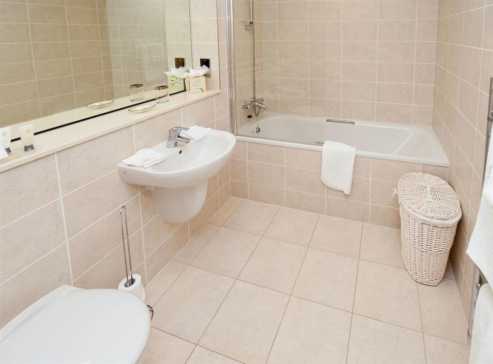 Spacious bathroom with shower over bath at North Bay Sands Apartment 1 in Scarborough, North Yorkshire