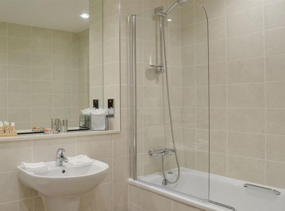 En-suite with shower over bath at North Bay Sands Apartment 2 in Scarborough, North Yorkshire