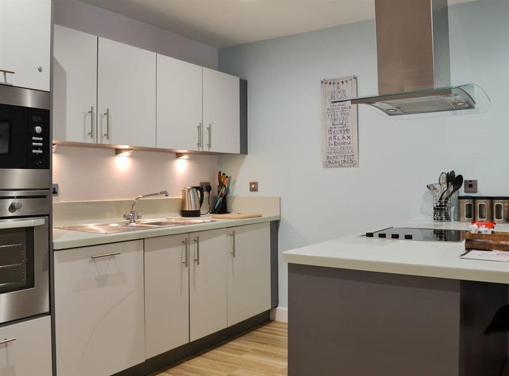 Well equipped kitchen area at North Bay Sands Apartment 2 in Scarborough, North Yorkshire