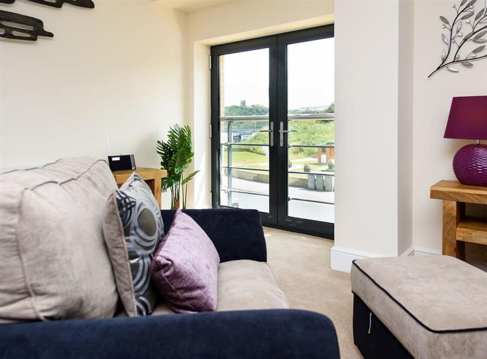 Double doors to Juliette balcony within living room at North Bay Sands Apartment 3 in Scarborough, North Yorkshire