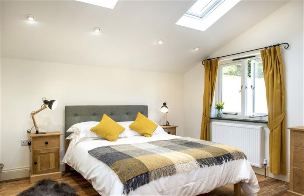 Bedroom two on the first floor, with 5’ king-size bed and en-suite shower room  at North Beer Cottage, Launceston