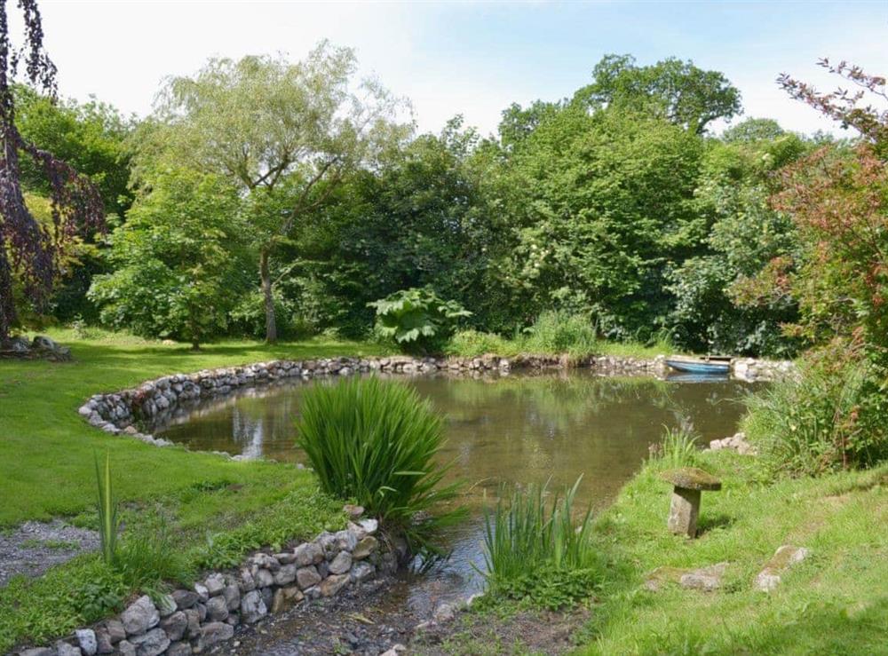 The pond is fed by a small stream running through the grounds