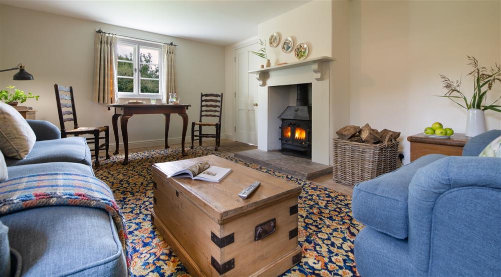 The sitting and dining room at North Cottage in Isle Of Purbeck, Dorset