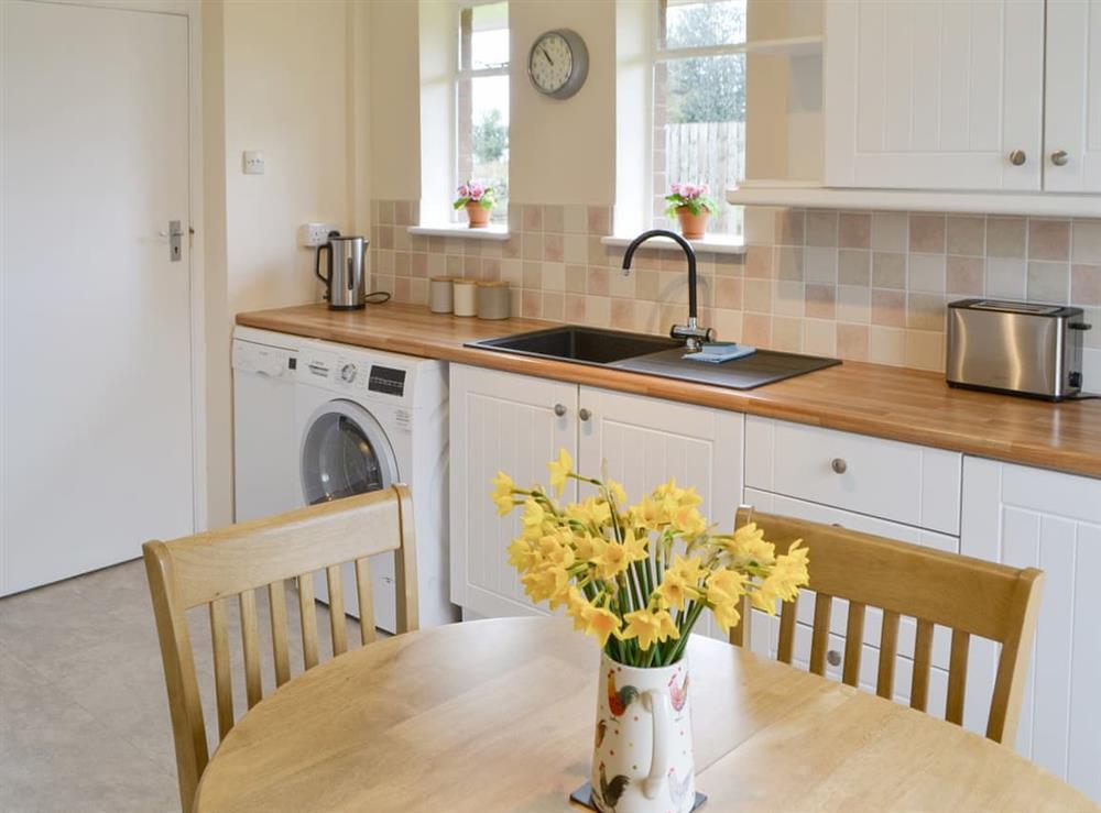Fully appointed kitchen with convenient dining area at North Farm Bungalow in Horsley, near Newcastle-upon-Tyne, Northumberland