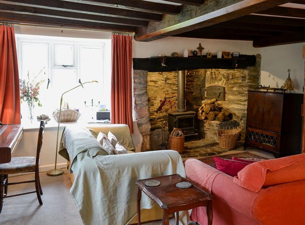 Comfortable and warm living room with wood burner (photo 2) at North Huckham in Huckham, near Dulverton, Somerset