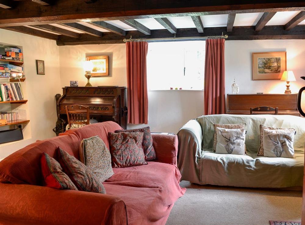 Comfortable and warm living room with wood burner (photo 3) at North Huckham in Huckham, near Dulverton, Somerset