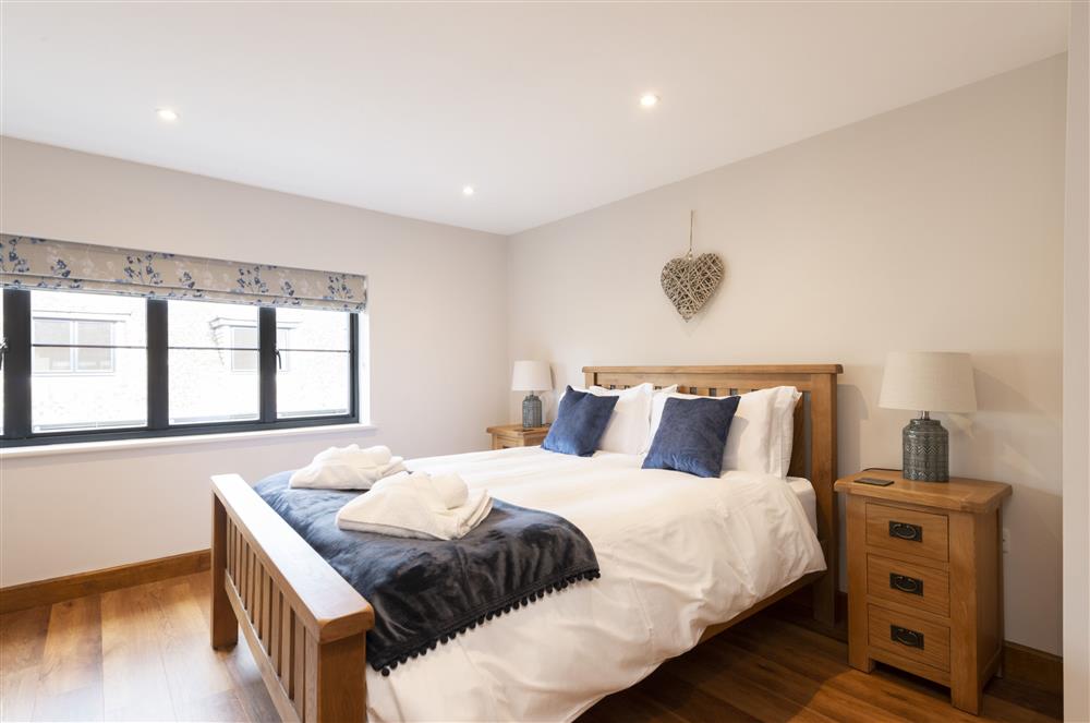 Bedroom four with a 5’ king-size bed  at North Leaze Farmhouse, North Cadbury