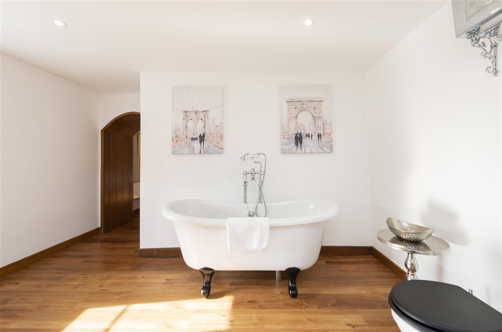 The beautiful roll-top bath, in bedroom one’s en-suite bathroom at North Leaze Farmhouse, North Cadbury