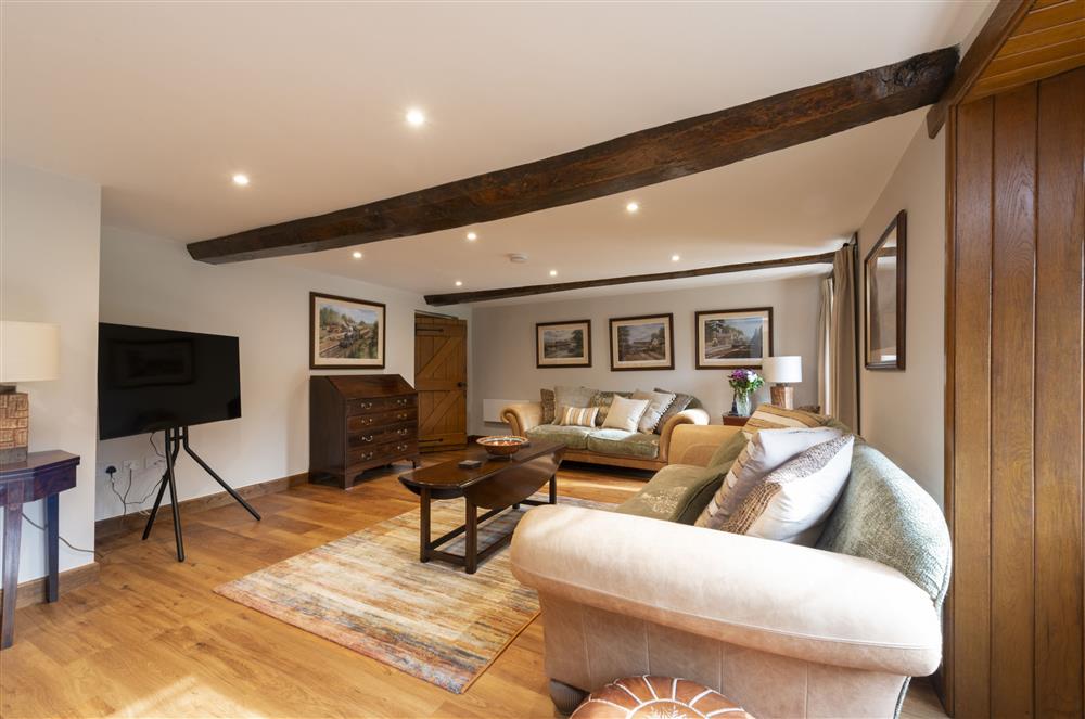 The cosy sitting room, with exposed beams at North Leaze Farmhouse, North Cadbury