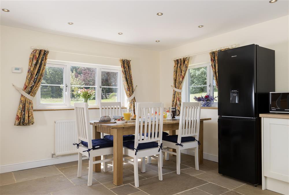 Ground floor: Open-plan kitchen/dining area with seating for five guests at North Leigh Barn, Crediton 