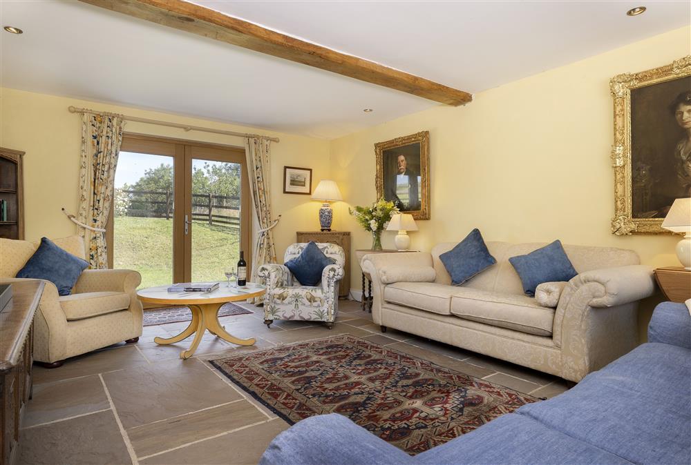 Ground floor: Sitting room with french doors leading out to the garden at North Leigh Barn, Crediton 